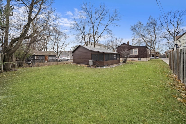 view of yard featuring a sunroom