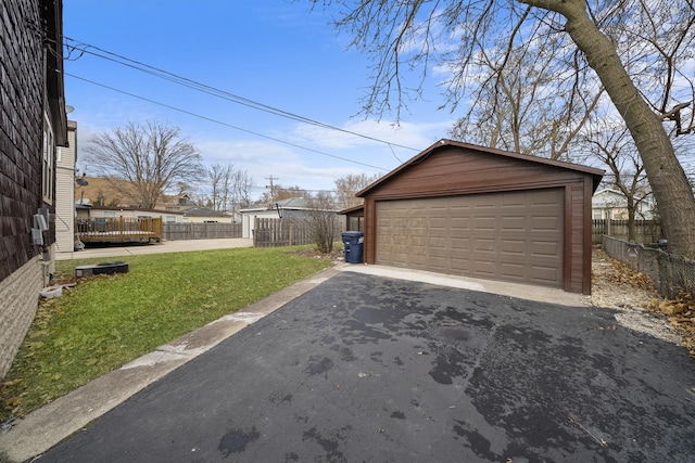 garage featuring a lawn