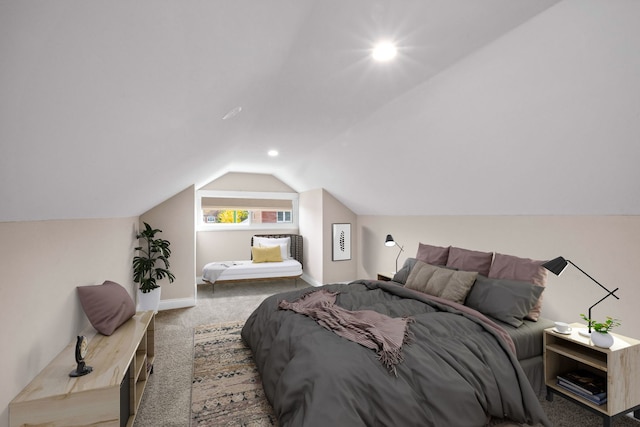 bedroom featuring carpet flooring and vaulted ceiling