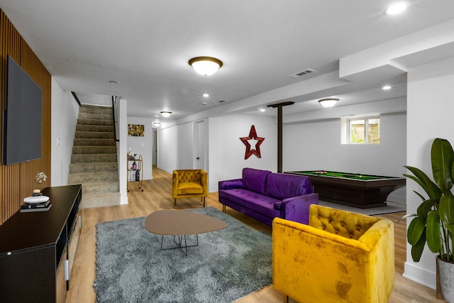 living room with light hardwood / wood-style floors and pool table