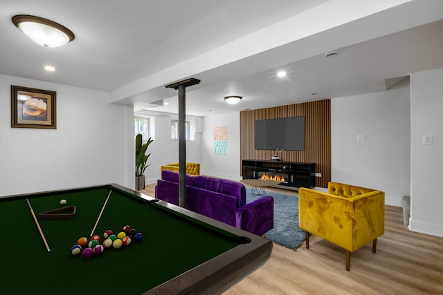 game room with hardwood / wood-style floors and billiards