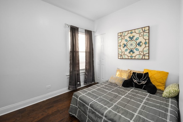 bedroom featuring dark wood-type flooring