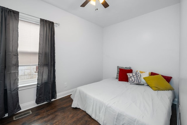 bedroom featuring ceiling fan and dark hardwood / wood-style flooring