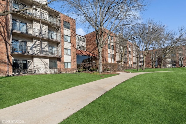 view of property's community with a yard