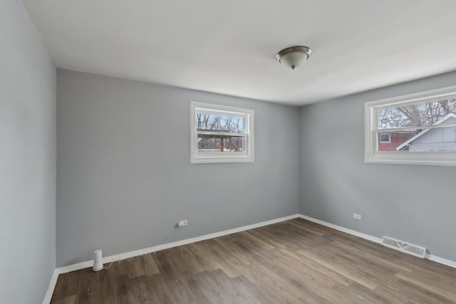 empty room featuring wood-type flooring