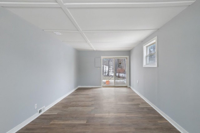 unfurnished room with wood-type flooring