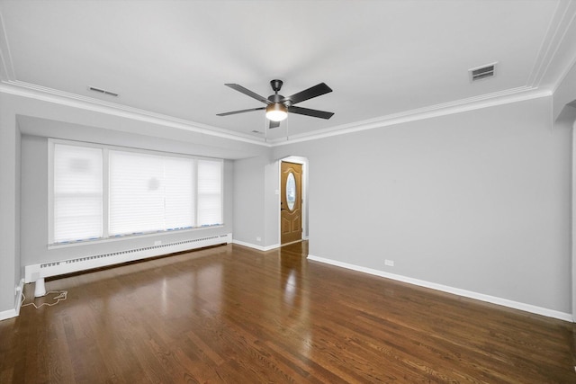 unfurnished room featuring dark hardwood / wood-style floors, baseboard heating, crown molding, and ceiling fan