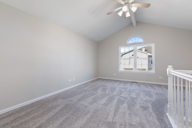 carpeted spare room featuring lofted ceiling with beams and ceiling fan