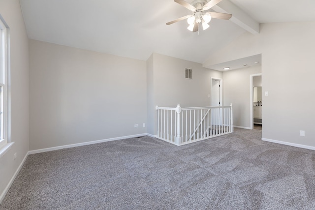 spare room with carpet floors, lofted ceiling with beams, and ceiling fan