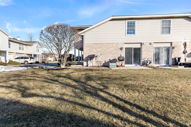 rear view of house with a lawn