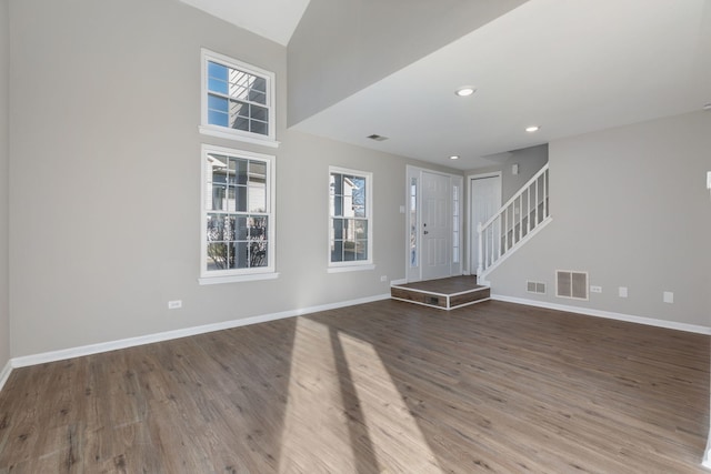 unfurnished living room with hardwood / wood-style flooring