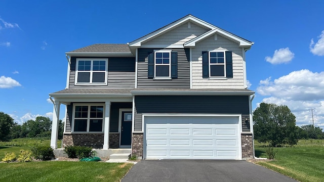 craftsman inspired home with a garage and a front lawn