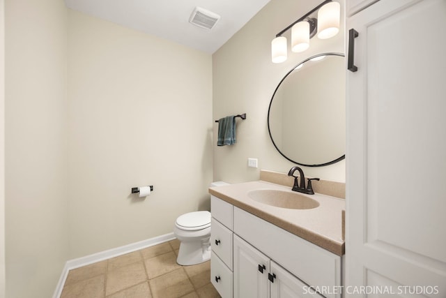 bathroom featuring visible vents, baseboards, toilet, and vanity