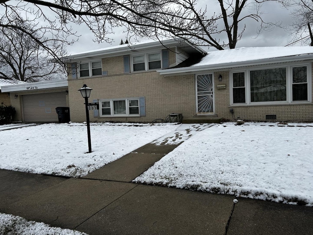 split level home with a garage