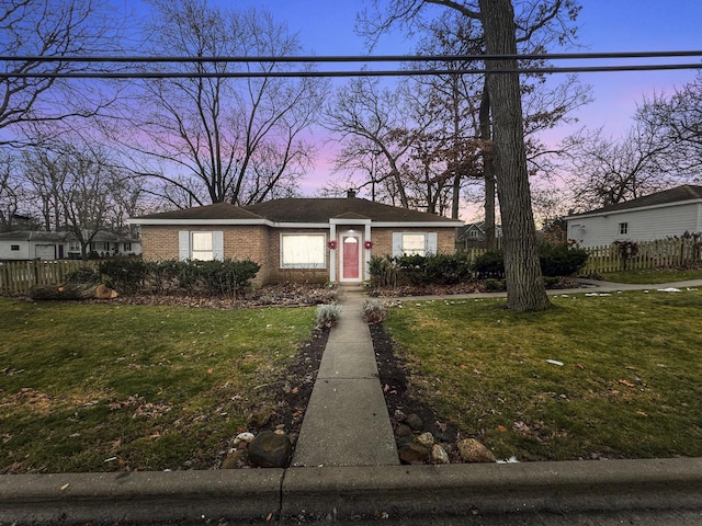 view of front of property with a yard