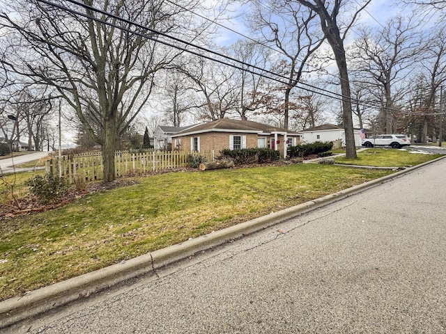 single story home with a front yard