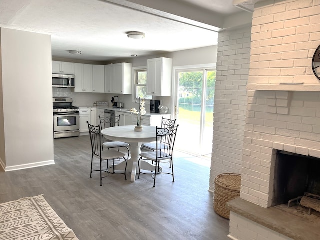 dining area with hardwood / wood-style floors and sink