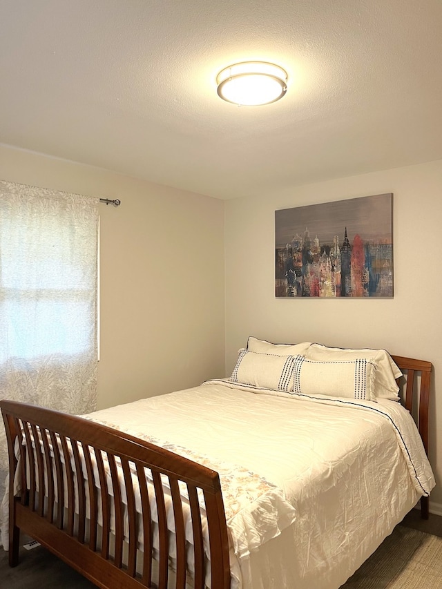 bedroom featuring wood-type flooring