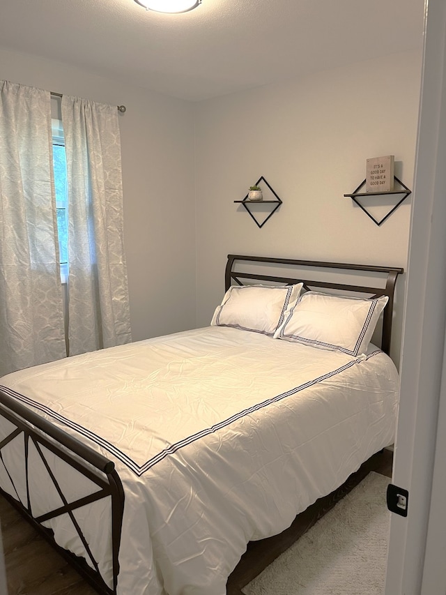 bedroom featuring hardwood / wood-style flooring