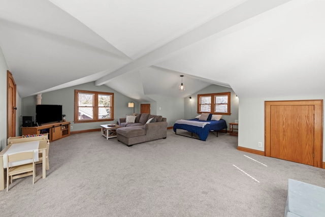 bedroom with lofted ceiling with beams, baseboards, and carpet floors