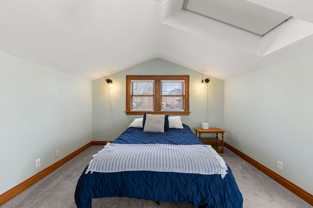 bedroom featuring baseboards, carpet, and vaulted ceiling