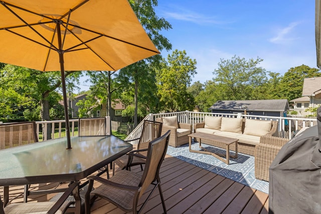 wooden deck with an outdoor living space and outdoor dining space