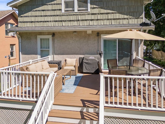 wooden deck featuring outdoor lounge area