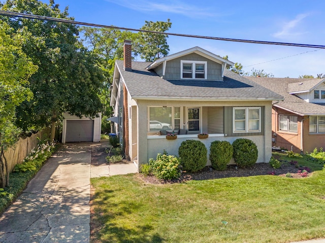 bungalow with fence, a chimney, a garage, an outbuilding, and driveway