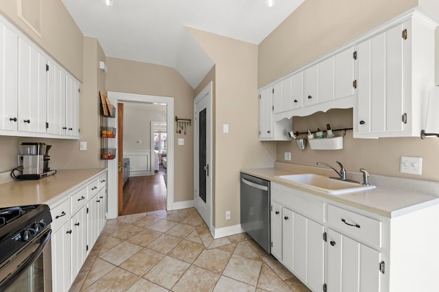 kitchen featuring black range with gas stovetop, a sink, light countertops, white cabinetry, and stainless steel dishwasher