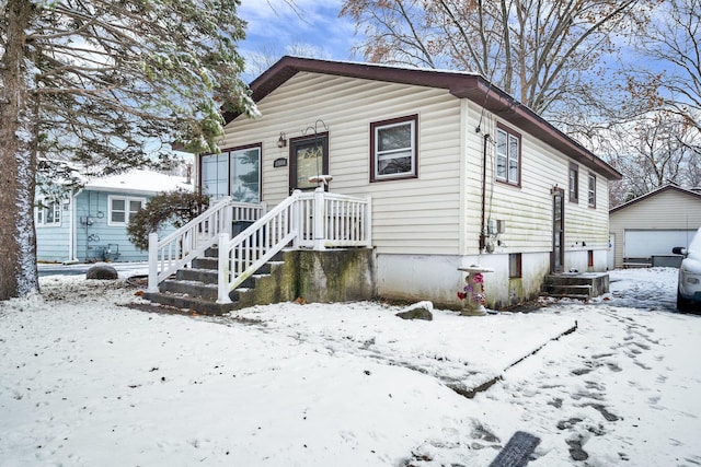 view of front of house with an outbuilding and a garage