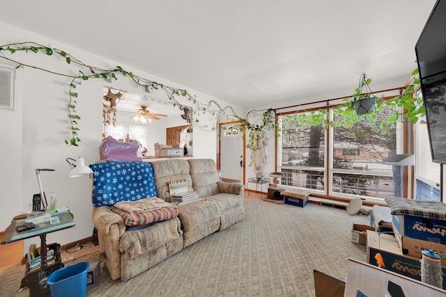 living room with ceiling fan and carpet floors