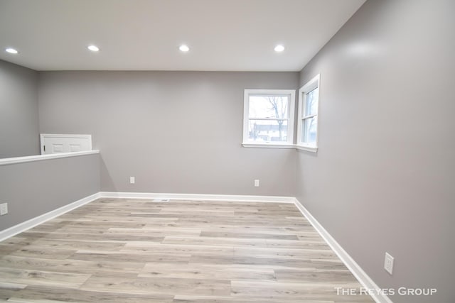 unfurnished room with light hardwood / wood-style flooring