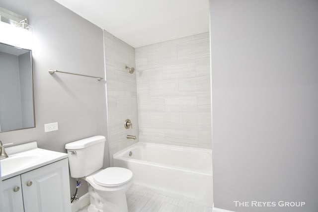 full bathroom featuring vanity, toilet, and tiled shower / bath