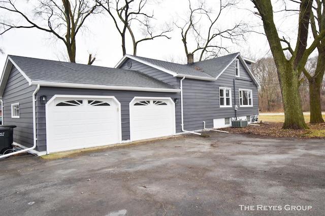 view of property exterior featuring a garage