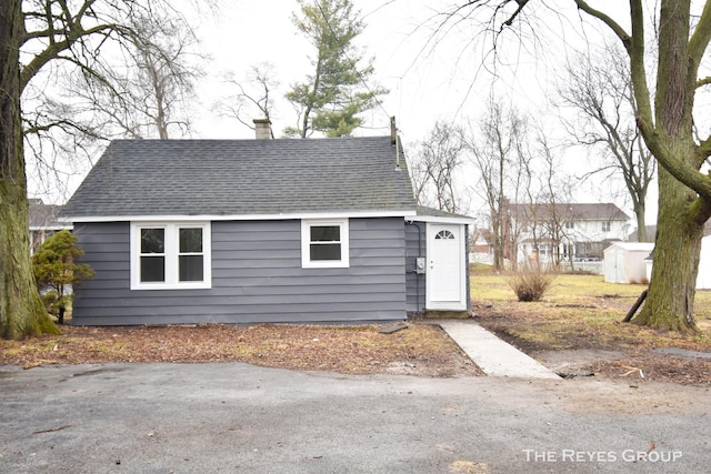 view of front of house with a storage unit