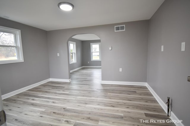 spare room with light hardwood / wood-style floors