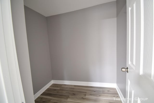 unfurnished room featuring dark hardwood / wood-style flooring