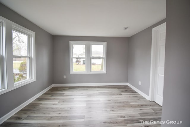 spare room featuring light hardwood / wood-style floors