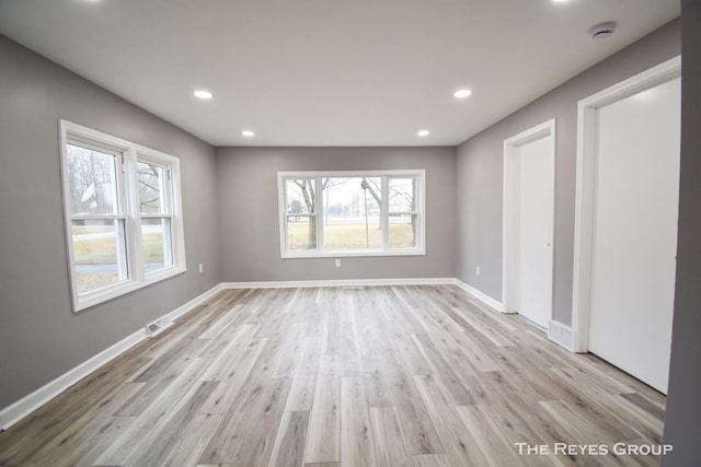 unfurnished room with light hardwood / wood-style floors