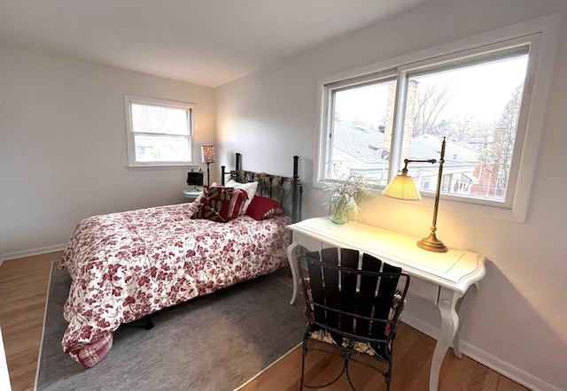 bedroom with dark wood-type flooring