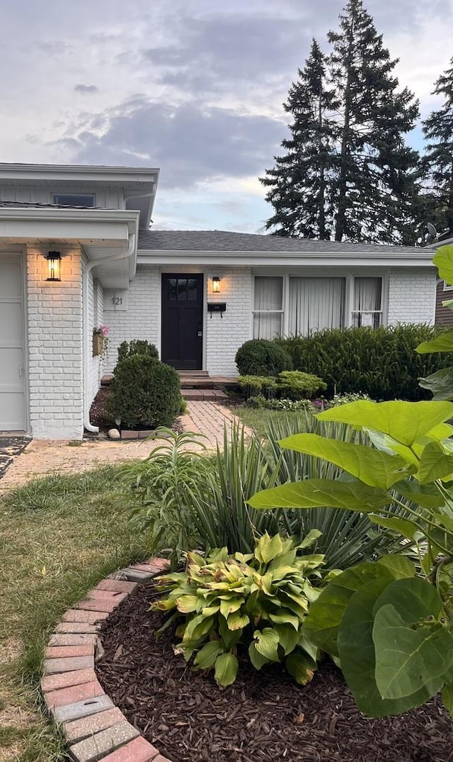 doorway to property featuring a garage