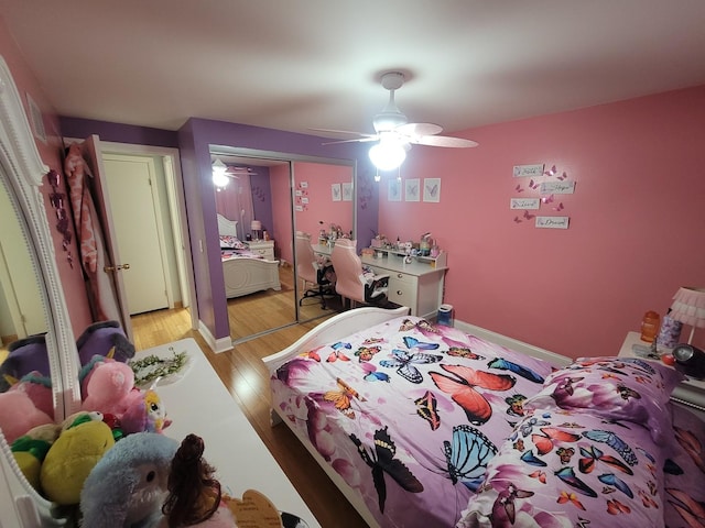 bedroom featuring light wood-type flooring, a closet, and ceiling fan