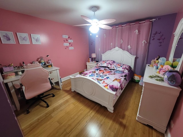 bedroom featuring hardwood / wood-style floors and ceiling fan