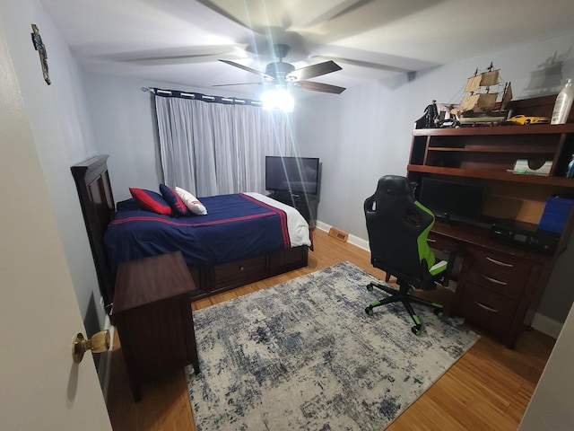 bedroom featuring light wood-type flooring and ceiling fan