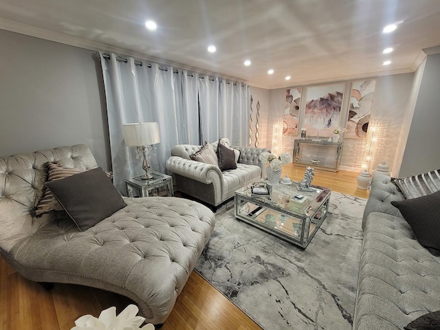 living room with hardwood / wood-style floors and ornamental molding