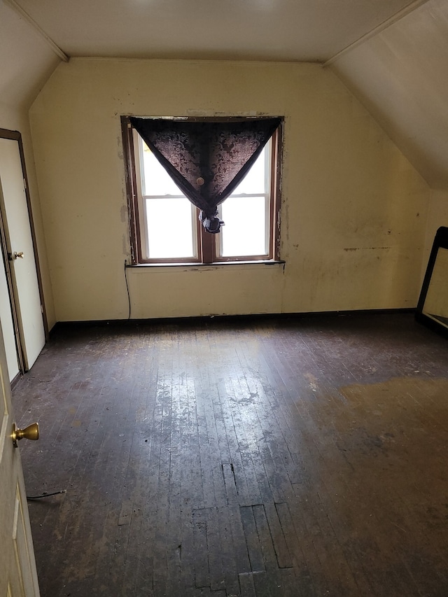 bonus room featuring dark hardwood / wood-style floors and lofted ceiling