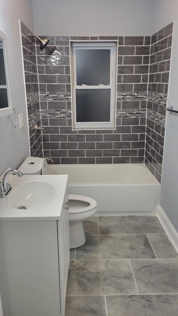 1918 S Kedzie Ave, Chicago, IL 60623 - full bathroom with vanity, toilet, tub / shower combination, and baseboards