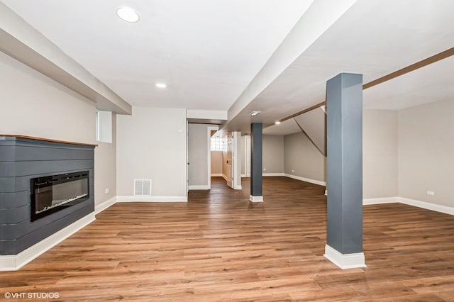 basement featuring hardwood / wood-style flooring