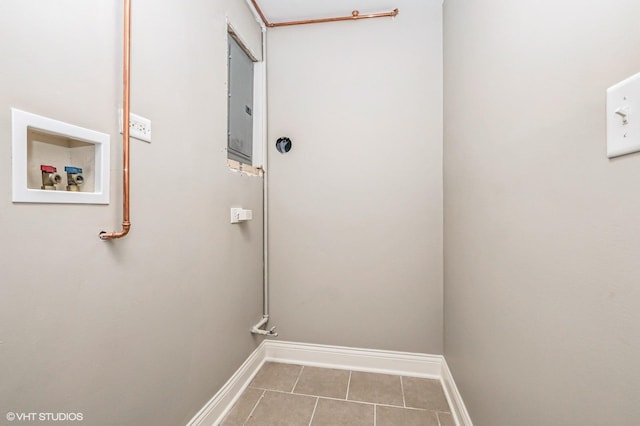 washroom with hookup for a washing machine, electric panel, and light tile patterned floors