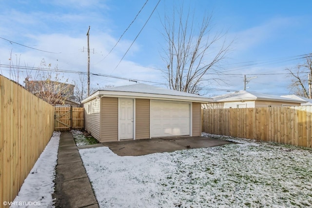 view of snow covered garage